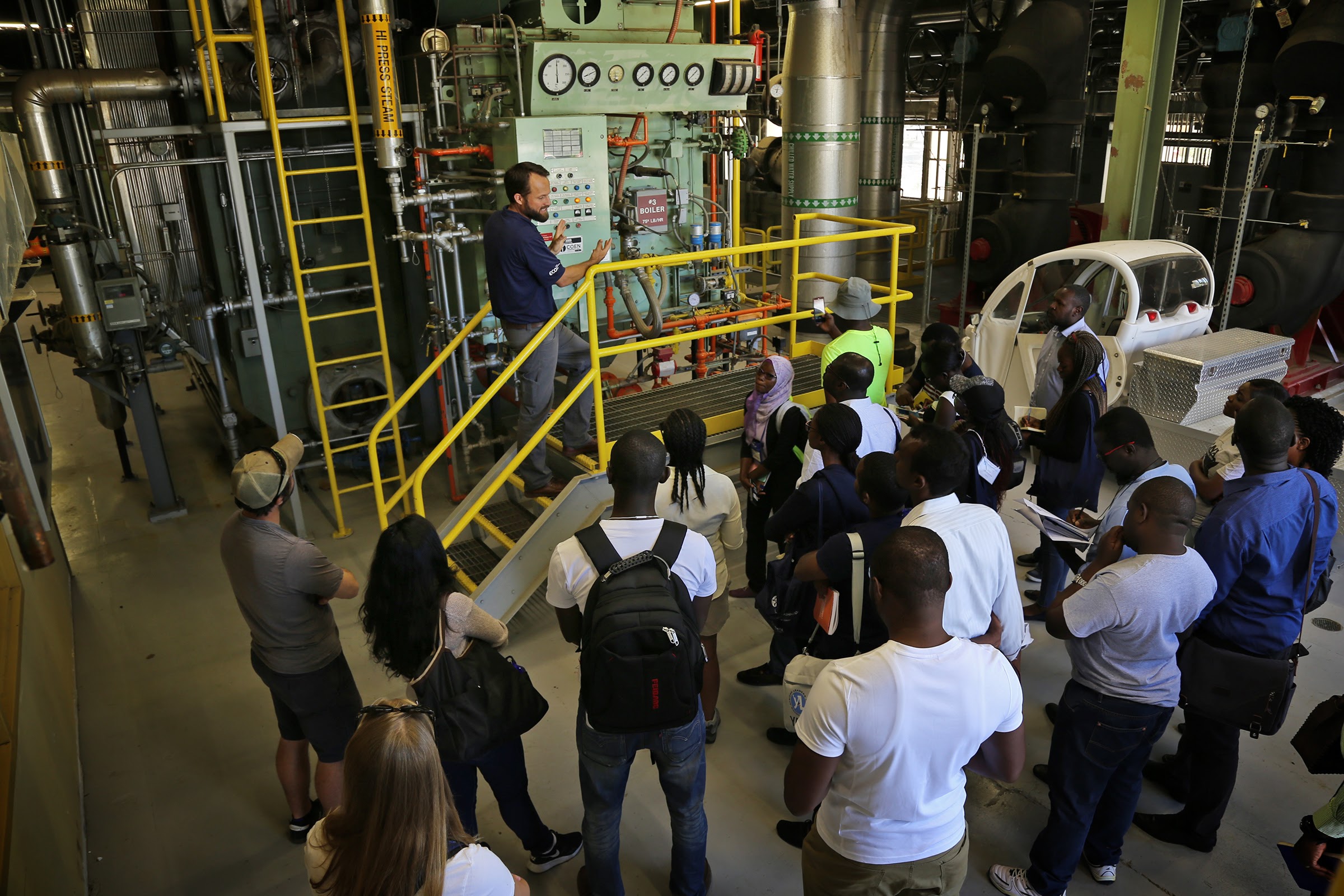Joshua Morejohn, executive director of Engineering and Utilities Operations, shows a boiler in the Central Heating and Cooling Plant to a facilities tour group. Boilers, which rely on fossil fuels to create steam, will be replaced with infrastructure that utilizes renewable heat sources through the Big Shift.