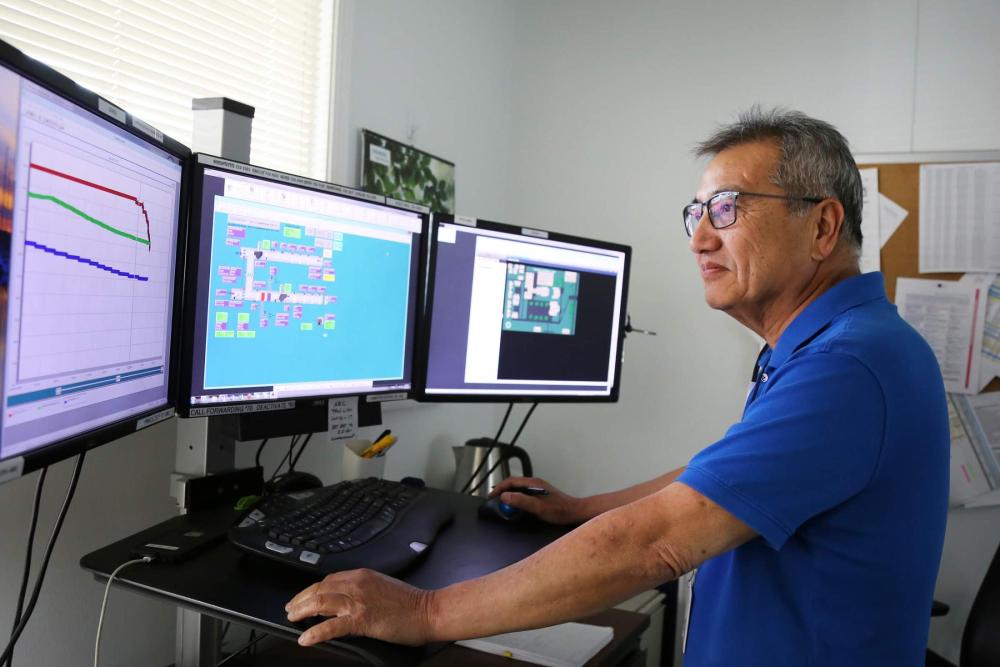 a UCD staff member looking at the building automation system